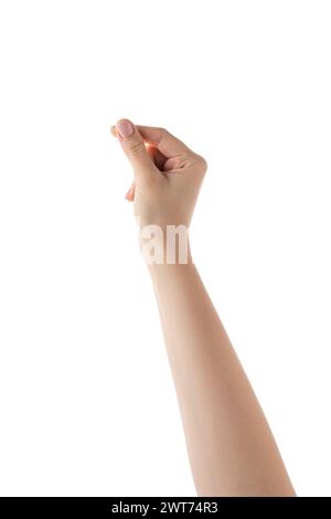 La mano destra della giovane donna tiene qualcosa di sottile o piccolo isolato su sfondo bianco Foto Stock