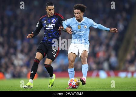 Oscar Bobb del Manchester City e Elias Achouri del Copenhagen durante il turno di UEFA Champions League 16 tra Manchester City e FC Copenhagen all'Etihad Stadium il 6 marzo 2024 a Manchester, Inghilterra. (Foto di Daniel Chesterton/phcimages.com) Foto Stock