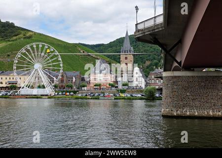 Scenic Landscape of Moselle River and City Skyline with Ferris Wheel in Bernkastel-Kues, germany Stock Photo