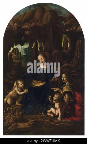La "Madonna delle rocce" di Leonardo da Vinci (1483-1486): Esposta al Museo del Louvre di Parigi e alla Galleria Nazionale di Londra, in due versioni, questo dipinto mostra la maestria del chiaroscuro e la prospettiva atmosferica di Leonardo da Vinci. L'opera raffigura la Vergine Maria, il bambino Gesù, Giovanni Battista e un angelo in una grotta rocciosa, a simboleggiare l'unità e la sacralità della natura e dell'umanità. Foto Stock