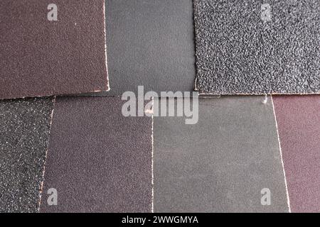 Molti fogli di carta vetrata come sfondo, vista dall'alto Foto Stock