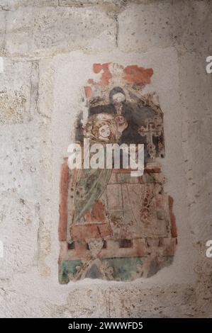 Vienna, Austria. Michaelerkirche (Chiesa parrocchiale di San Michael) è una chiesa parrocchiale cattolica in Michaelerplatz, nel primo distretto di Vienna. Pittura murale esposta, Martirio della Santa messa, intorno al 1325 Foto Stock