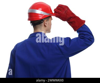 Giovane uomo che indossa l'equipaggiamento di sicurezza su sfondo bianco Foto Stock