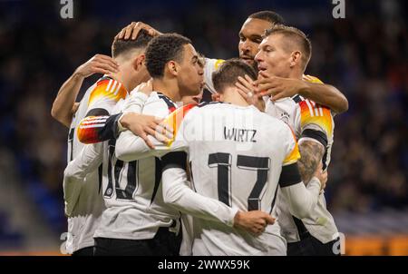 Lione, Francia. 23 marzo 2024. Torjubel: Jamal Musiala (Deutschland) Joshua Kimmich (Deutschland) Florian Wirtz (Deutschland) Jonathan Tah (Deutschland Foto Stock