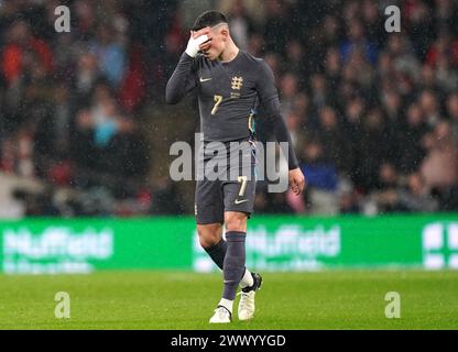 L'inglese Phil Foden reagisce dopo che il belga Youri Tielemans (non nella foto) segna il primo gol della squadra durante l'amichevole internazionale al Wembley Stadium di Londra. Data foto: Martedì 26 marzo 2024. Foto Stock