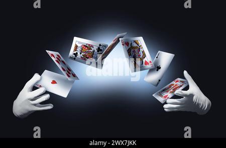 Mago che esegue il trucco delle carte su sfondo a colori, primo piano Foto Stock