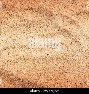 Sabbia di mare calda e asciutta, vista dall'alto. Sabbia dorata con spazio di copia. Bellissimo sfondo di sabbia Foto Stock