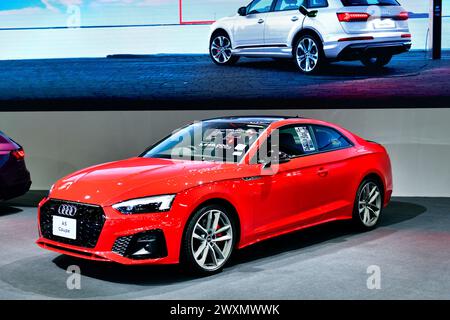 Thailandia - 27 marzo 2024: Audi A5 Coupé rossa al Salone Internazionale dell'automobile di Bangkok 45 a Nonthaburi Foto Stock