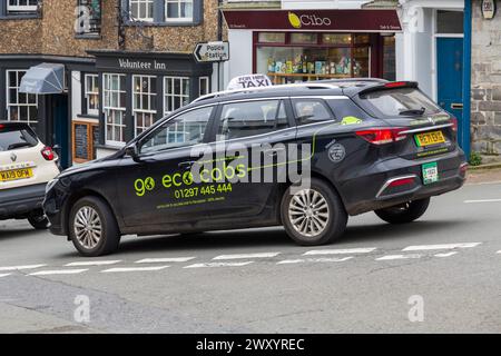Go eco cabine West Dorset's 1 ° società di taxi completamente elettrico - 100% elettrico a Lyme Regis, Dorset Regno Unito a marzo Foto Stock