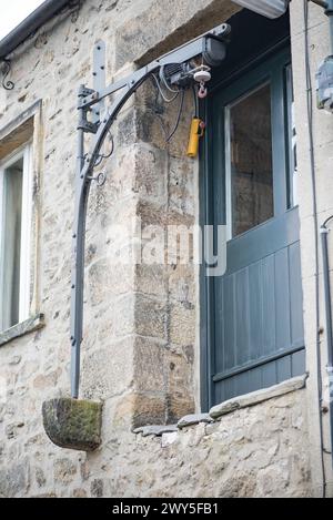 Il paranco del sistema a puleggia, o i resti di in alcuni casi, sono caratteristiche peculiari di alcune proprietà di Settle (North Yorkshire) che consentono il sollevamento al piano superiore Foto Stock