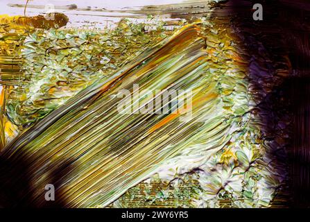 Un vivace dipinto di un mucchio di foglie gialle e verdi Foto Stock