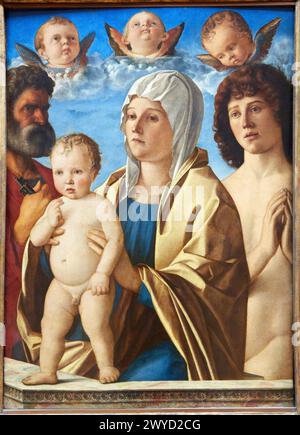 La Vierge et l'Enfant entre Saint Pierre et Saint Sébastien. Giovanni Bellini. Museo del Louvre. Parigi. Francia. Foto Stock