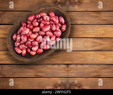 Semi di fagioli pinto freschi nel recipiente - Phaseolus vulgaris pinto Foto Stock