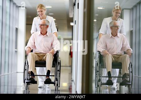 Infermiera con paziente in sedia a rotelle, corridoio, Onkologikoa Hospital, Oncology Institute, Case Center per la prevenzione, la diagnosi e il trattamento del cancro, Donostia, San Sebastian, Gipuzkoa, Paesi Baschi, Spagna. Foto Stock