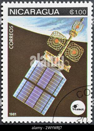 Francobollo cancellato stampato dal Nicaragua, che mostra Intelsat IV A, Exploration of Space, circa 1981. Foto Stock