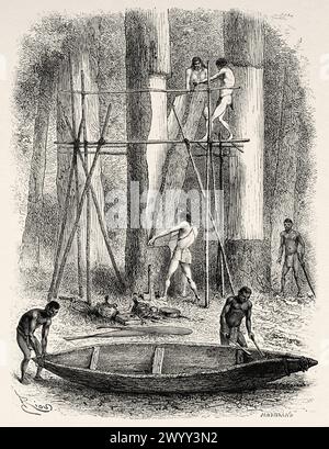 Nativi indigeni che costruiscono una canoa sulle rive del fiume Oyapock, Guyana francese, Sud America. Disegno di Edouard Riou (1833 - 1900) da Cayenne alle Ande (1878-1879) di Jules Crevaux (1847 - 1882) le Tour du Monde 1880 Foto Stock