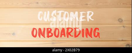 Simbolo di onboarding del cliente. Parole concettuali onboarding del cliente su una bella parete di legno. Bellissimo sfondo in legno. Onboarding dei clienti aziendali Foto Stock