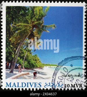 Spiaggia di Corallo alle Maldive su francobollo Foto Stock