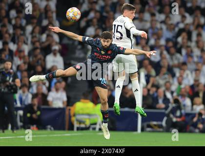 Madrid, Spagna. 9 aprile 2024. Josko Gvardiol del Manchester City e Joselu del Real Madrid sfidano il pallone durante la partita di UEFA Champions League al Santiago Bernabau di Madrid. Il credito per immagini dovrebbe essere: Paul Terry/Sportimage Credit: Sportimage Ltd/Alamy Live News Foto Stock