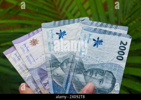 Banconote e monete dall'Indonesia Foto Stock