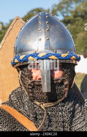 England, East Sussex, Battle, The Annual October Battle of Hastings Re-Enactment Festival, Portrait of Man Dressed in Medieval Chain mail Armour Foto Stock