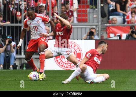 Monaco, Germania. 13 aprile 2024. MONACO DI BAVIERA, GERMANIA - 13 APRILE: Mathys Tel di Bayern Muenchen e Jan Thielmann di 1. FC Koeln durante la partita di Bundesliga tra FC Bayern Muenchen e 1. FC Koeln all'Allianz Arena il 13 aprile 2024 a Monaco, Germania.240413 SEPA 24 012 - 20240413 PD3670 credito: APA-PictureDesk/Alamy Live News Foto Stock