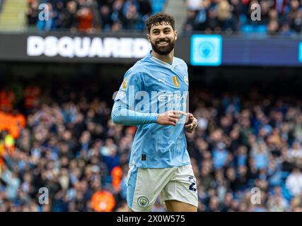 (240414) -- MANCHESTER, 14 aprile 2024 (Xinhua) -- Josko Gvardiol del Manchester City celebra la partita di Premier League inglese tra Manchester City e Luton Town a Manchester, Regno Unito, 13 aprile 2024. (XINHUA) SOLO PER USO EDITORIALE. NON IN VENDITA PER CAMPAGNE PUBBLICITARIE O DI MARKETING. DIVIETO DI UTILIZZO CON AUDIO, VIDEO, DATI, ELENCHI DI INCONTRI, LOGHI CLUB/LEAGUE O SERVIZI "LIVE" NON AUTORIZZATI. UTILIZZO ONLINE IN-MATCH LIMITATO A 45 IMMAGINI, SENZA EMULAZIONE VIDEO. NON È CONSENTITO L'USO IN SCOMMESSE, GIOCHI O PUBBLICAZIONI PER SINGOLI CLUB/CAMPIONATO/GIOCATORI. Foto Stock