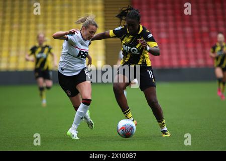 Londra, Regno Unito. 14 aprile 2024. Londra, 14 aprile 2024: Kayleigh Green (15 Charlton Athletic) messo da parte da Michelle Agyemang (11 Watford) durante la partita del Barclays Womens Championship tra Watford e Charlton Vicarage Road, Londra, Inghilterra. (Pedro Soares/SPP) credito: SPP Sport Press Photo. /Alamy Live News Foto Stock