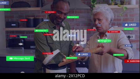 Immagine di icone dei social media sulla coppia afroamericana che cucina insieme a casa Foto Stock