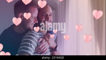 Immagine di icone del cuore su diverse coppie gay che abbracciano Foto Stock