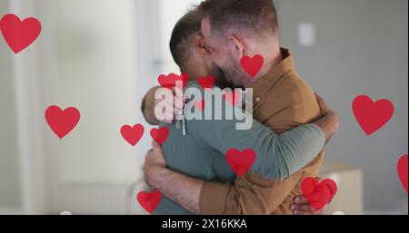 Immagine di icone del cuore su diverse coppie gay che abbracciano Foto Stock