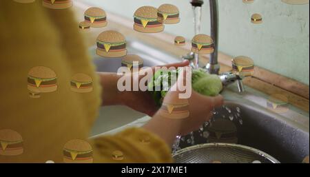 Immagine di icone di hamburger sopra la lavatrice della donna caucasica Foto Stock