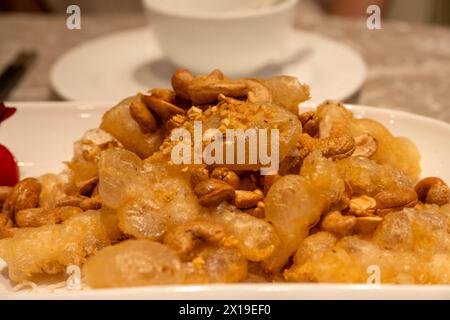 Ristorante cinese, calamari fritti in pastella croccante, Hong Kong, Cina. Foto Stock