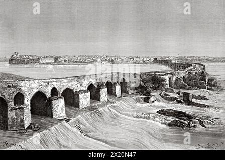 La Band-e Kaisar. Ponte di Valeriano o Shadirwan era un antico ponte ad arco nella città di Shushtar. Costruito dai Sasanidi, usando i prigionieri di guerra romani come forza lavoro, nel III secolo d.C. su ordine sasanide, provincia del Khuzestan, Iran. Medio Oriente. Disegno di Barclay. Persia, Chaldea e Susiana 1881-1882 di Jane Dieulafoy (1851 - 1916) le Tour du Monde 1886 Foto Stock