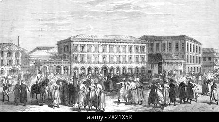 La nuova Oriental Bank and Share-Market, Bombay, 1865. "Lo stile dell'architettura è italiano; ma, mentre la parte inferiore è interamente costruita in pietra e rusticata, i piani superiori sono in mattoni appuntiti... è stata eretta su disegno del defunto signor William Tracey, ingegnere civile...l'edificio sulla destra è quello che è stato temporaneamente occupato dalla Banca di Bombay...il mercato azionario si trova nelle vicinanze della Oriental Bank, che è la località più adatta, non solo perché contigua alla maggior parte delle banche, ma anche perché qui la folla o la folla di broker, composta per Foto Stock