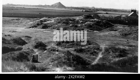 Fotografia che mostra le cabine dell'esercito britannico al Gloster Lodge, dimostrando le posizioni mimetiche e difensive. Foto Stock