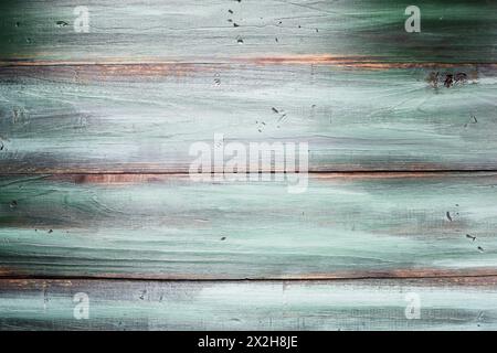 Vista del tavolo di sfondo verde brillante e legno dalle texture tonali. Immagine ripresa dalla vista dall'alto. Foto Stock