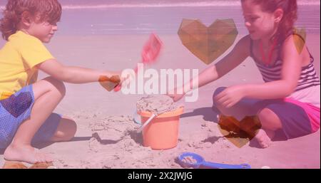 Immagine di icone del cuore su felici fratelli caucasici che giocano in spiaggia Foto Stock