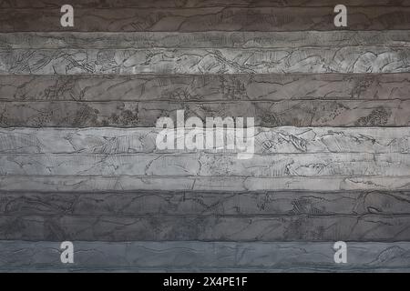 Una foto ravvicinata per il materiale di sfondo su una parete di cemento progettata per sembrare una sezione trasversale di uno strato Foto Stock