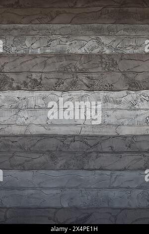 Una foto ravvicinata per il materiale di sfondo su una parete di cemento progettata per sembrare una sezione trasversale di uno strato Foto Stock