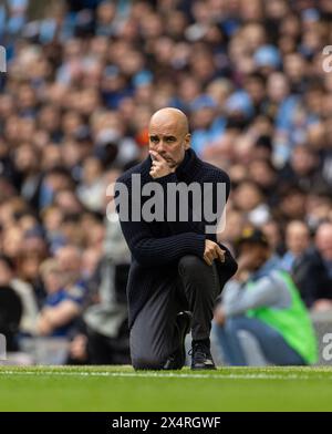 (240505) -- MANCHESTER, 5 maggio 2024 (Xinhua) -- il manager del Manchester City Pep Guardiola reagisce durante la partita di Premier League inglese tra Manchester City e Wolverhampton Wanderers a Manchester, in Gran Bretagna, il 4 maggio 2024. (XINHUA)SOLO PER USO EDITORIALE. NON IN VENDITA PER CAMPAGNE PUBBLICITARIE O DI MARKETING. DIVIETO DI UTILIZZO CON AUDIO, VIDEO, DATI, ELENCHI DI INCONTRI, LOGHI CLUB/LEAGUE O SERVIZI "LIVE" NON AUTORIZZATI. UTILIZZO ONLINE IN-MATCH LIMITATO A 45 IMMAGINI, SENZA EMULAZIONE VIDEO. NON È CONSENTITO L'USO IN SCOMMESSE, GIOCHI O PUBBLICAZIONI PER SINGOLI CLUB/CAMPIONATO/GIOCATORI. Foto Stock