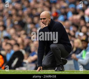 (240505) -- MANCHESTER, 5 maggio 2024 (Xinhua) -- il manager del Manchester City Pep Guardiola reagisce durante la partita di Premier League inglese tra Manchester City e Wolverhampton Wanderers a Manchester, in Gran Bretagna, il 4 maggio 2024. (XINHUA)SOLO PER USO EDITORIALE. NON IN VENDITA PER CAMPAGNE PUBBLICITARIE O DI MARKETING. DIVIETO DI UTILIZZO CON AUDIO, VIDEO, DATI, ELENCHI DI INCONTRI, LOGHI CLUB/LEAGUE O SERVIZI "LIVE" NON AUTORIZZATI. UTILIZZO ONLINE IN-MATCH LIMITATO A 45 IMMAGINI, SENZA EMULAZIONE VIDEO. NON È CONSENTITO L'USO IN SCOMMESSE, GIOCHI O PUBBLICAZIONI PER SINGOLI CLUB/CAMPIONATO/GIOCATORI. Foto Stock