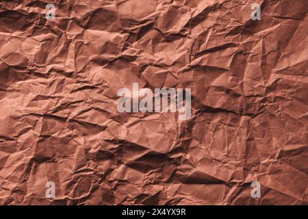 Trama increspata di carta marrone come sfondo, vista dall'alto Foto Stock