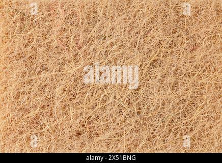 Sfondo astratto realizzato in tessuto morbido con una lunga pila di colore beige, foto macro Foto Stock