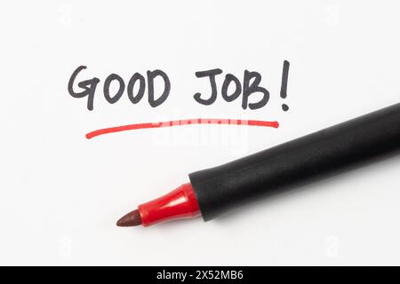 Scrittura a mano buona parola di lavoro o testo con pennarello rosso isolato su sfondo bianco Foto Stock
