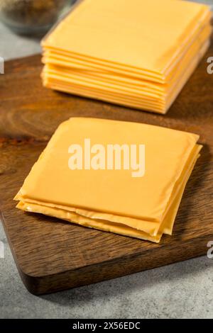 Yellow Cheddar American Cheese Singles in a Stack Foto Stock