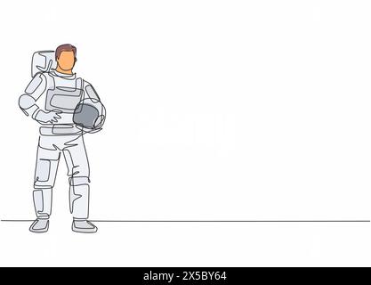 Disegno continuo di una linea di giovane astronauta maschio posa in piedi e tenendo il casco. Professione professionale concetto minimalista. Tracciato a linea singola Illustrazione Vettoriale