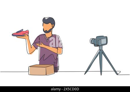 Un singolo disegno su una linea il blogger arabo maschile fa una recensione video sulla fotocamera sul tema delle sneakers. Shopping online, social media e concetto di influencer. Illustrazione Vettoriale