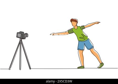 Una sola linea disegna un giovane uomo che fa esercizio sul tappeto con la fotocamera. Riprese video per blog su videocamera. Formazione online. Sport a casa. Continua Illustrazione Vettoriale