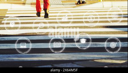 Immagine di più icone digitali contro la parte bassa dell'uomo che attraversa la strada Foto Stock